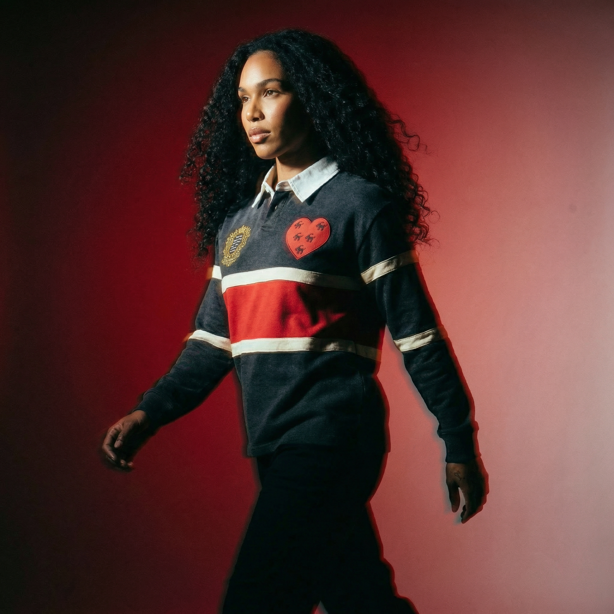 Singer Monica twinning with her daughter Laiyah at Disney World wearing matching Citizens of Heaven More Love Sweatsuits and socks